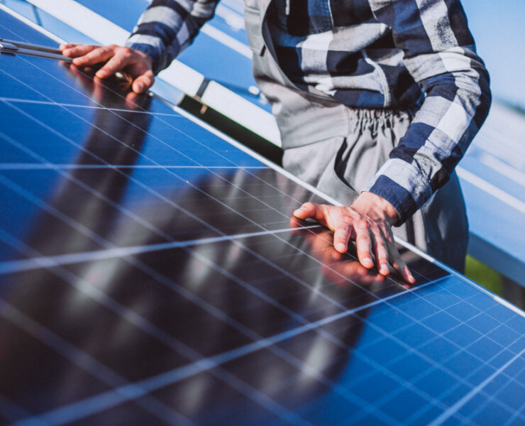 man-worker-in-the-firld-by-the-solar-panels